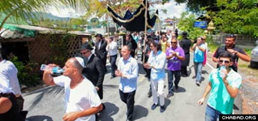 Celebrants marched in a procession before bringing the Torah into the new Chabad center.