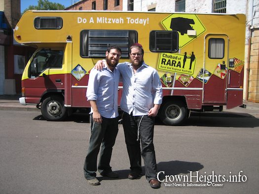 Yossi Spigler and Sholom Rapaport who volunteered as roving Rabbis in 2008, pose in front of the RARA Mitzvah Tank. Illustration Photo.