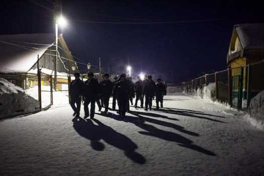 Workers return to their sector at night.
