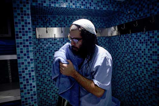 Gaby Danieli washed at the Ohel Chabad Lubavitch Center, which abuts the cemetery, before paying his respects at the grave. 