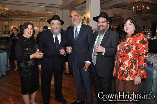 Mrs. Deitsch (far left) with her husband R' Mordechai Deitsch at this years Oholei Torah's dinner.