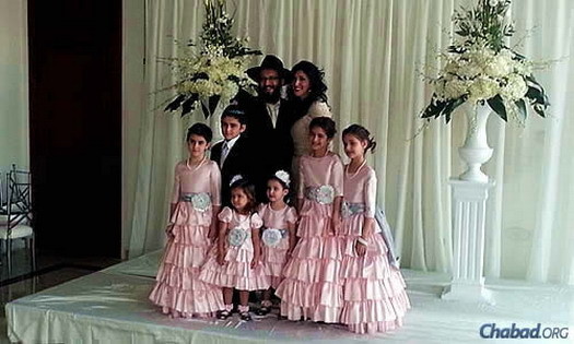 Rabbi Yossi and Dina Eber, co-directors of the Chabad Jewish Center of West Pasco in Trinity, Fla., and their six children. Eber and her 10-year-old twin daughters are flying to New York for the conference.