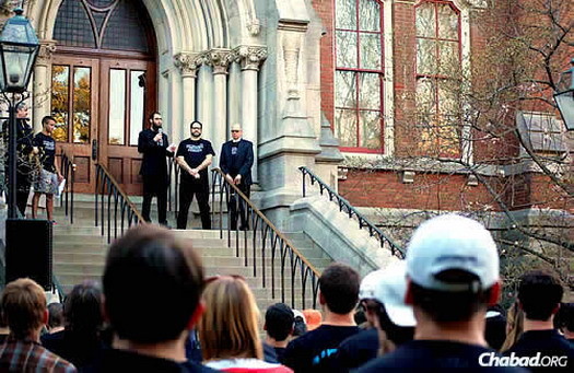 Rabbi Shlomo Rothstein, co-director at the Rohr Chabad House at Vanderbilt University in Nashville, Tenn., speaks on the steps of Kirkland Hall, the school's administration offices, after a March 30 rally in response to vandalism at a Jewish fraternity house. Next to him is Hillel campus director Ari Dubin, and at right, associate provost and dean of students Mark Bandas. AEPi president Josh Hyman and director of the Nashville Jewish Federation Mark Freedman also spoke.