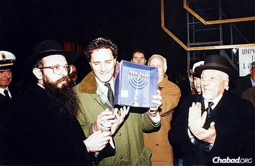 Toaff, right, at the annual public menorah-lighting in Rome's Piazza Barberini Square. To the left is Hazan, and in the middle is the city's former Mayor Francesco Rutelli, who served from 1994 to 2001.