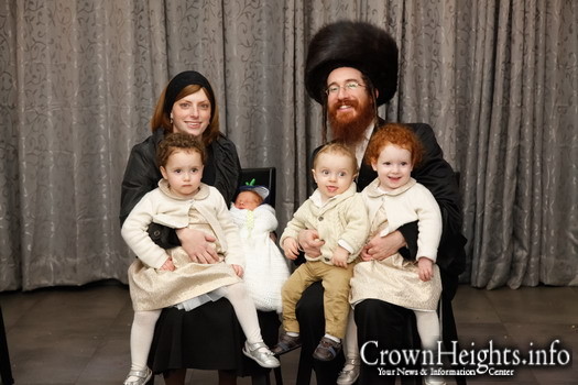 Yerachmiel Elimelech Weiss with his wife and four children.