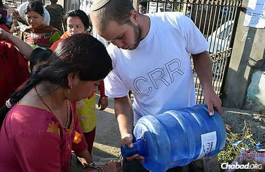 A band of volunteers—many of them young Israelis—are going from camp to camp distributing water, food, medicine, warm clothing, and most important of all, waterproof tents. They are led by Chani Lifshitz, co-director of Chabad of Nepal, with her husband, Rabbi Chezky Lifshitz.