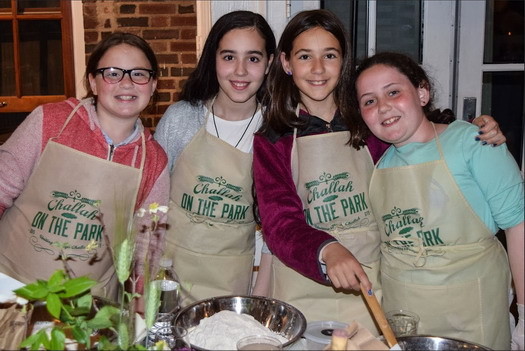 Everyone had a blast making challah during Challah On The Park, including these young girls. From left: Leah Roth, Aden Ehrenberg, Isabel Bender and Chana Koyfman.