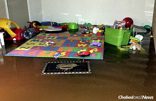 Toys and baby items float in the deep water that seeped into the Mart household.