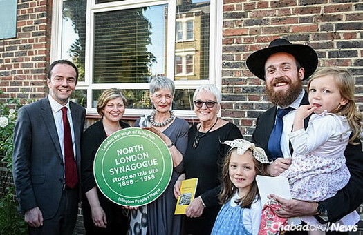 The unveiling of the “Islington People’s Plaque” on the site of the former North London Synagogue in Islington. From left are: Councilor James Murray, Emily Thornberry MP, Judith Hassan OBE (the great-niece of the synagogue’s first rabbi, Morris Josef), Hassan's sister and Rabbi Mendy Korer, co-director of Chabad-Lubavitch of Islington, with two of his three daughters.