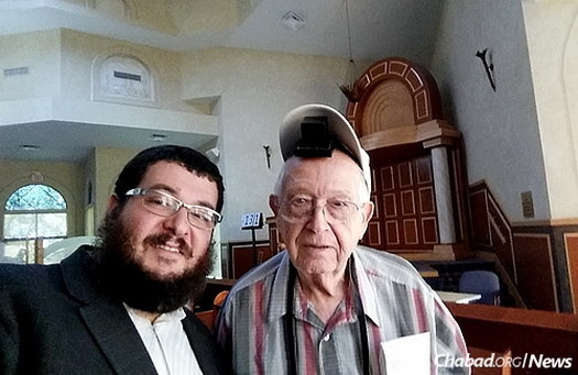 Rabbi Levi Chanowitz, director of development at Synagogue of Inverrary–Chabad in South Florida, with congregant Michael Kahan.