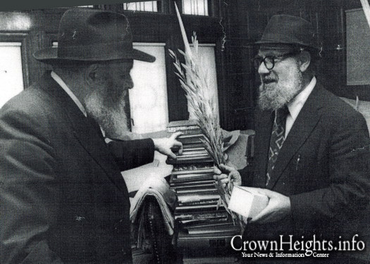 Rabbi Nissan Mindel receiving a set of Lulav and Esrog from the Rebbe.