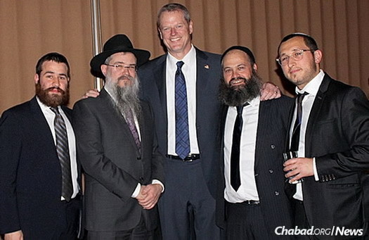 From left: Rabbi Moshe Liberow, Rabbi Yosef B. Friedman, Baker, Lipsker and Friedman.