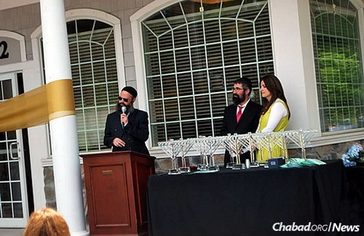Lipsker at the grand opening of Chabad of Peabody Jewish Center, led by Rabbi Nechemia and Raizal Schusterman, above, which was celebrated the same day as the gala dinner.