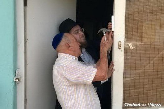 Rabbi Peretz Lazaroff and Rabbi Yisroel Wolff have been hopping around the Caribbean islands of Aruba and Curacao sharing Torah thoughts and Jewish practice (like the mezuzah pictured) with locals and tourists.