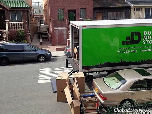 The moving truck outside the Kazens' former home in Brooklyn, N.Y.