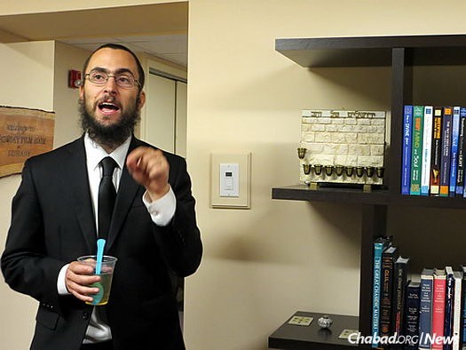 Rabbi Grodnitzky gives a tour of the downstairs area, which includes a library and media room next to a larger room for classes, events, performances and ample space to unwind.