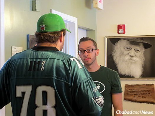 University of the Arts sophomore Andrew Hutz, left, chats with attorney David Krisch.