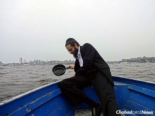 The rabbi periodically takes a boat out to the river to immerse new food vessels, as mandated by Jewish law. A mikvah would make the process much easier.