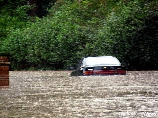 Cars were no match for the rivers and streams that overran their banks when the local dams failed after more than a foot-and-a-half of rain over the course of three days.