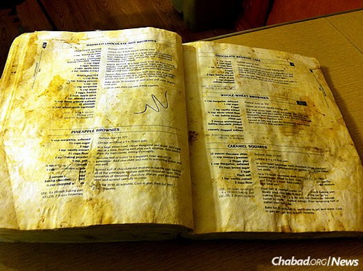 The book became glued to Jewish kitchens; the typical volume is replete with handwritten notes, food stains and flour smudges.