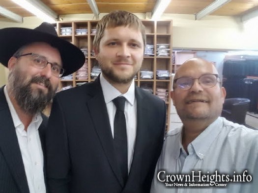 CTVP director Rabbi Menachem Kutner purchasing new clothing for Meir