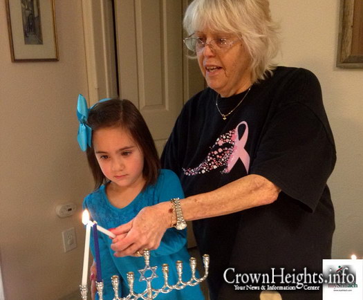 Chanie Mendelsohn lights Menorah with a woman out in the middle of Wyoming​