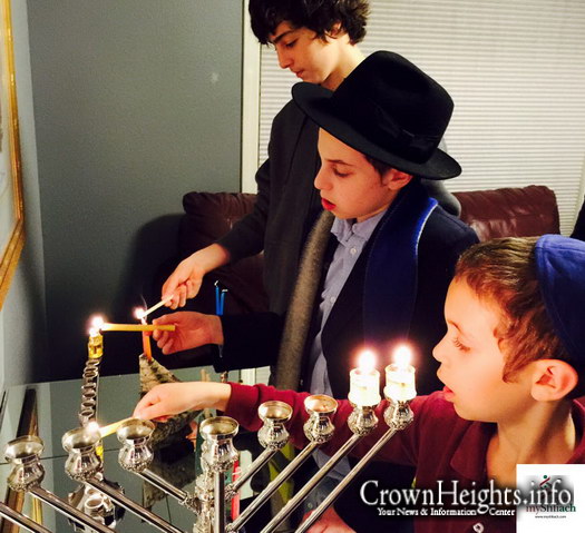 The Greenbergs of Vancouver, WA light Menorah with their classmates​