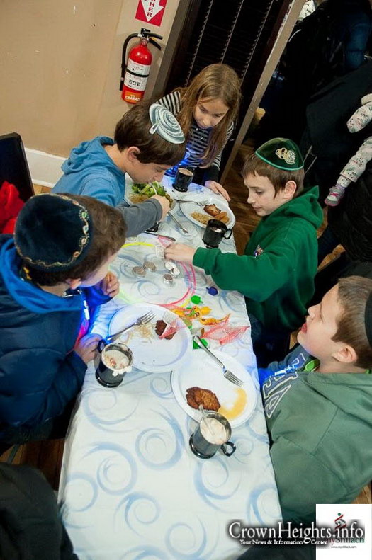 Zalman Tiechtel of Champaign, IL rans a booth at Chabad's Chanukah event
