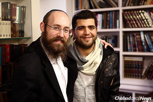 Rabbi Shneur Simcha Landa, who co-directs Chabad at Netanya Academic College in Israel, with a student there.