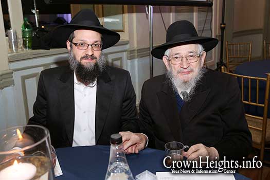 R' Bentzion Friedman OBM sitting with his son Yossi Friedman YBD"L at last years Hatzalah Melava Malka.