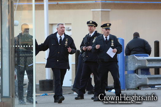 Inspector George Fitzgibbon (right) at the scene of a shooting on Empire Boulevard.