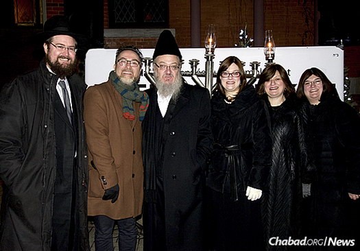 At the annual Outremont public menorah-lighting are, from left: Rabbi Winterfeld, City Councillor Richard Ryan, Yaakov Pollack, Borough Councillor Mindy Pollack, Sheindy Pollack and Bruchy Winterfeld, who co-directs Chabad Mile End with her husband.