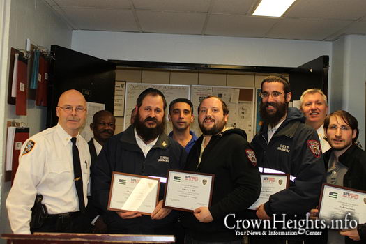 Inspector George Fitzgibbon awarding Shomrim Volunteers with Citizen of the Month Award following their successful apprehension of a pair of muggers.