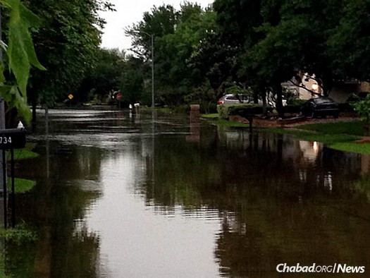 A flooded street in a Jewish neighborhood just days before the start of Passover. 
