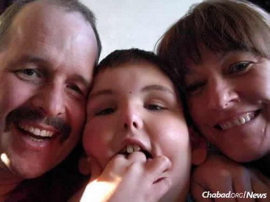 Raffle winner Trenton with his parents, Ryan and Linette Whiteman