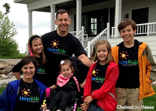 With her parents, Jo and Toby Schifsky, and three siblings: Roman, Lily and Simone