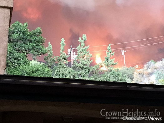 The fire as seen from the home of Yair Haim, whose family was evacuated last week with thousands of others. They have since returned.