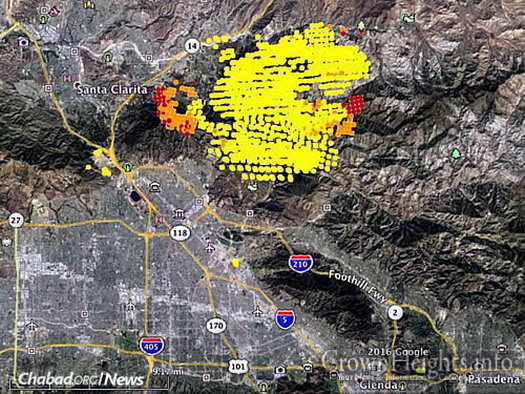 A map shows heat detected from the “Sand Fire” by a satellite. The red dots were current as of Monday afternoon. At that time, the fire was actively spreading east of Santa Clarita and Highway 14, as well as to the west. (Photo: Wildfire Today)