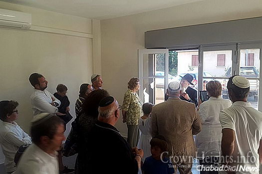 Rabbi Yossef Pinson, in doorway, executive director of Chabad-Lubavitch of Nice-Côte d’Azur, started visiting the Jews of Corsica more than 40 years ago.