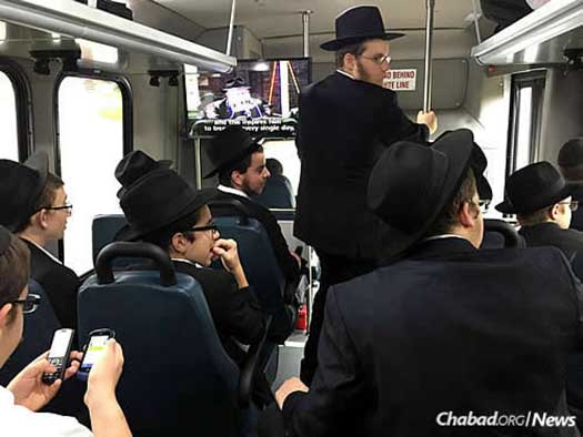 The boys get to their destinations in three buses that take them directly to their routes. While onboard, they share ideas and watch inspirational videos of the Lubavitcher Rebbe.